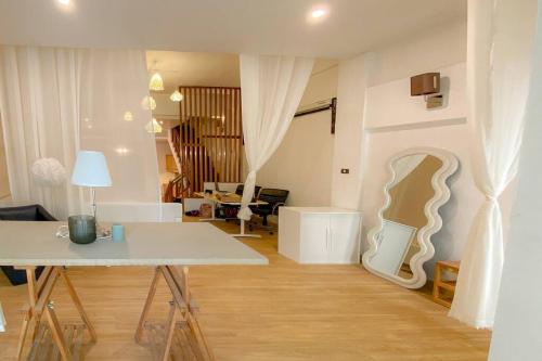 a living room with a table and a couch at Huge Living Room + 5 bedrooms with Private baths in Bangkok