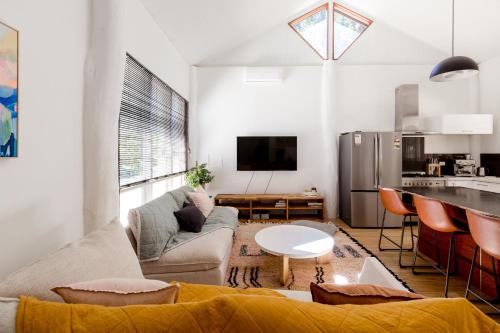 a living room with a couch and a table at Barn Haus in Margaret River Town