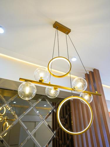 a chandelier hanging from a ceiling in a room at Casa Arabella - Wind Residences Tower 5 2018 in Tagaytay