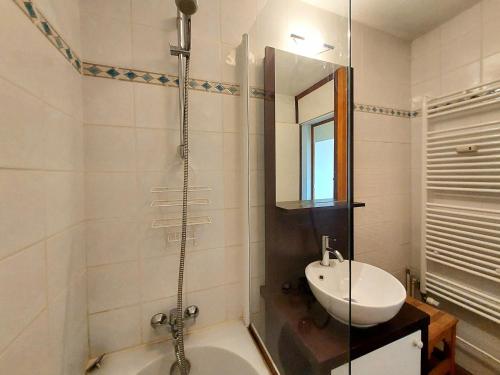 a bathroom with a tub and a sink and a shower at Appartement La Plagne, 2 pièces, 5 personnes - FR-1-351-30 in La Plagne