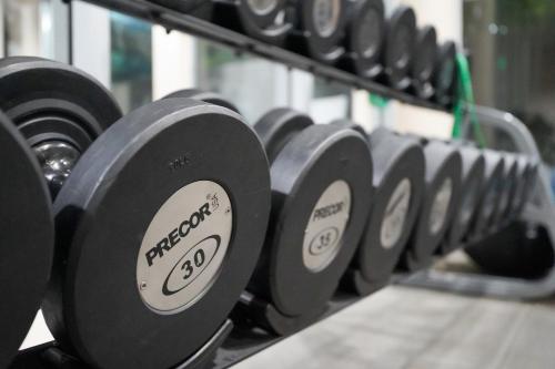 a row of black dumbbells in a gym at Holiday Inn Express Boise Downtown by IHG in Boise