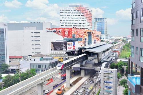 a train station in the middle of a city at Best Western Plus Wanda Grand Hotel in Nonthaburi