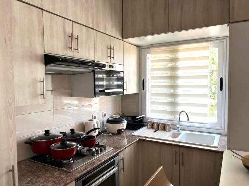 a kitchen with some pots and pans on a stove at Mahajanga Residences in Mahajanga