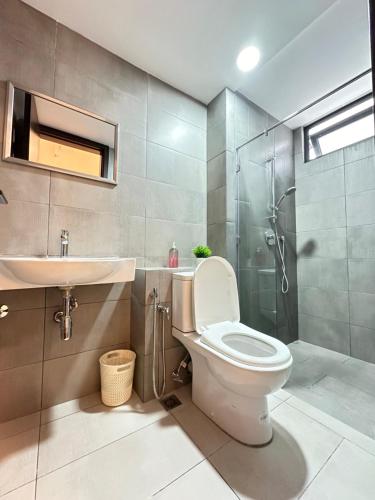 a bathroom with a toilet and a sink and a shower at K Avenue by BeMy guest in Kota Kinabalu