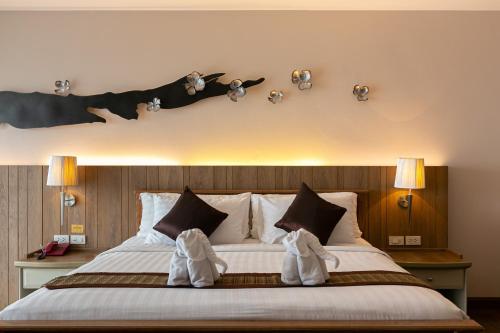 Grand Ratchapruek Hotelにあるベッド