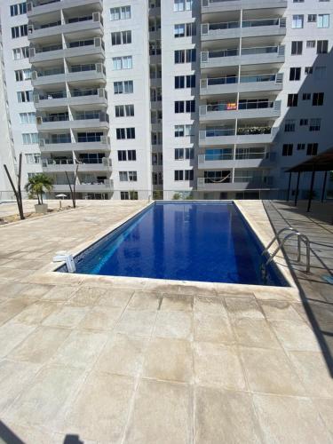 a swimming pool in front of some tall buildings at 504 - Exclusive apto palmetto in Valledupar