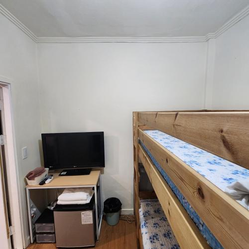 Телевизор и/или развлекательный центр в Joy Guesthouse