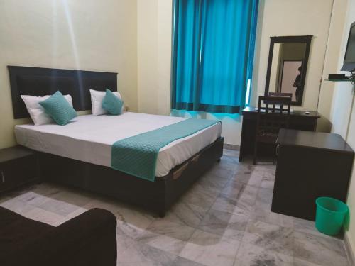 En eller flere senger på et rom på Hotel Royal Fort - Chandwaji