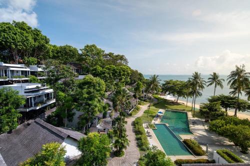 an aerial view of a resort with a swimming pool and the ocean at Turi Beach Resort in Nongsa