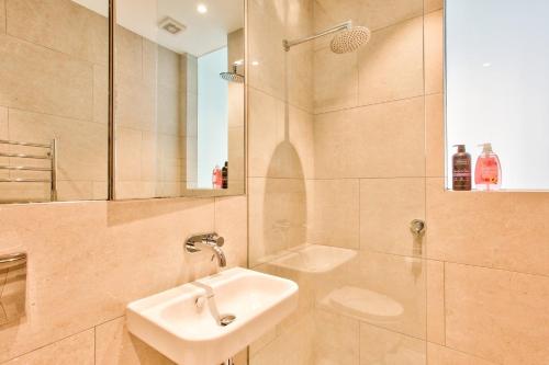 a bathroom with a sink and a shower at Astounding 3 Bedroom House Surry Hills 2 E-Bikes Included in Sydney