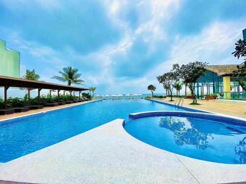 a large swimming pool in a resort at Aria Vũng tàu in Vung Tau