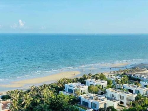 an aerial view of a beach with white buildings at Aria Vũng tàu in Vung Tau