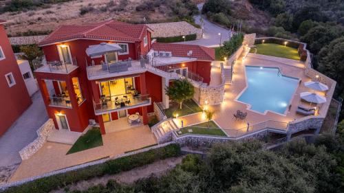 an aerial view of a house with a swimming pool at Crystal Palace - Luce in Skala Kefalonias