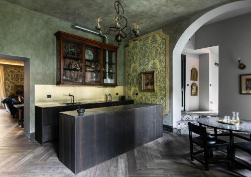 a kitchen with a large island in a room at Villa Castelli in Menaggio