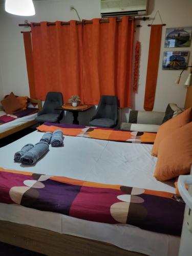 Ένα ή περισσότερα κρεβάτια σε δωμάτιο στο Vila Mala Evropa