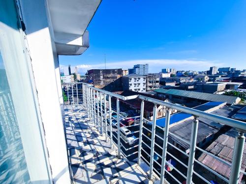 a balcony with a view of a city at Résidence FAMILIA PHOENIX in Douala