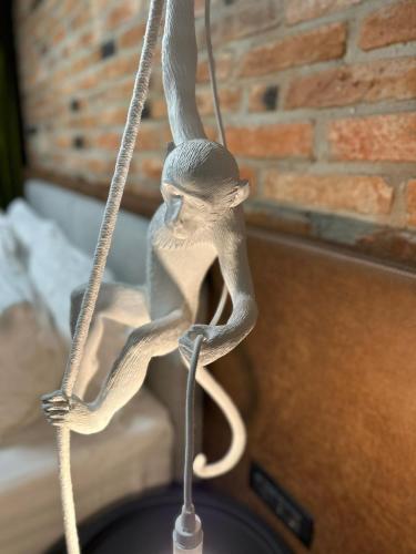 a figurine of a monkey hanging from a rope at Nani Nani Boutique in Braşov