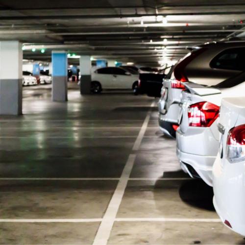 a parking garage with cars parked in it at Hotel Stäfeli in Lech am Arlberg