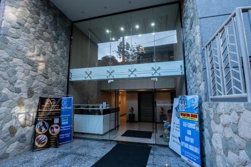 an entrance to a building with a sign in front of it at Johannes Condo in Baguio Megatower IV in Baguio