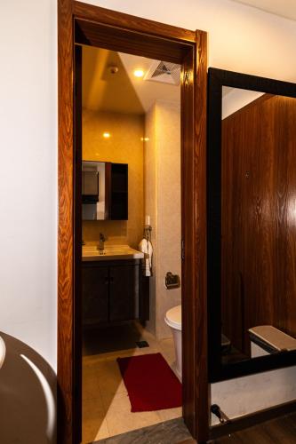 a bathroom with a tub and a sink and a toilet at Johannes Condo in Baguio Megatower IV in Baguio
