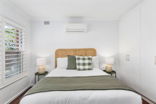Ένα ή περισσότερα κρεβάτια σε δωμάτιο στο Surfside Escape - A Local Lifestyle at North Beach