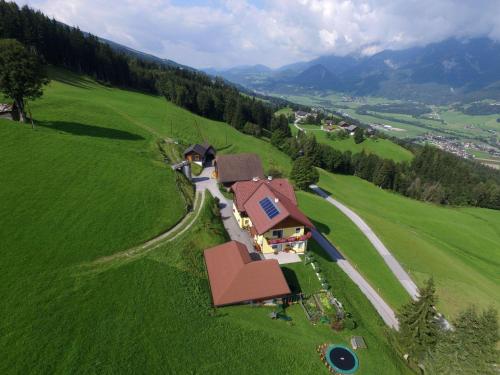 a house in the middle of a green field at Waldherrhof in Aich