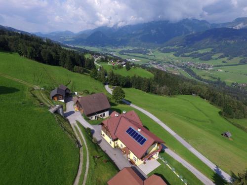 an aerial view of a house in a green field at Waldherrhof in Aich