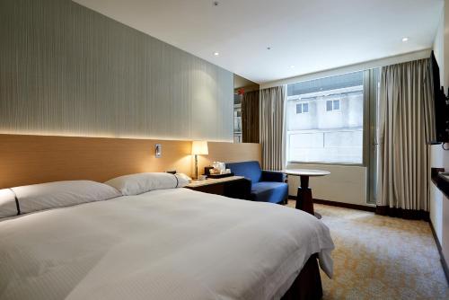 Postel nebo postele na pokoji v ubytování K Hotel Tianjin