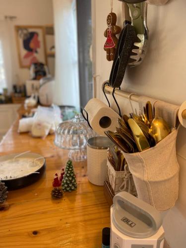 a kitchen counter with a utensil holder on a table at Maryland Khaoyai Annapolis Pool Villa in Ban Nong Song Hong