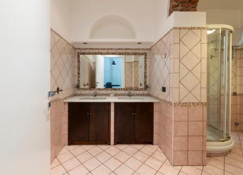 a bathroom with a sink and a mirror at Nice apartment in the heart of Porta Venezia in Milan