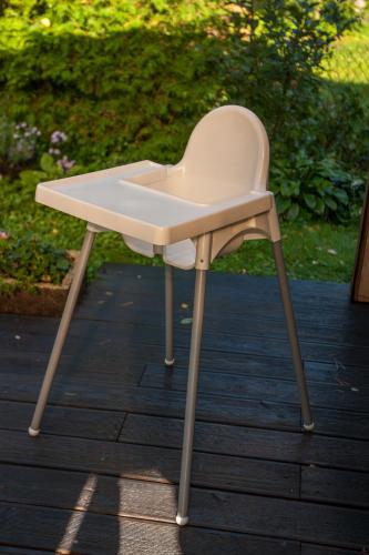 a white chair sitting on top of a table at Lauku iela 25 in Jūrmala