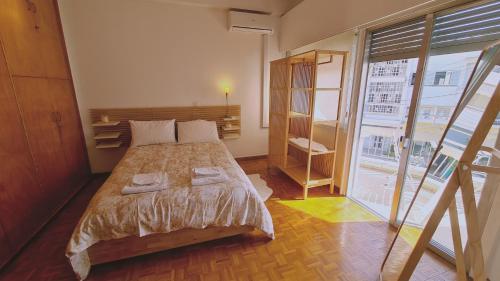 A bed or beds in a room at STAY Chrysanthemum City Apartment