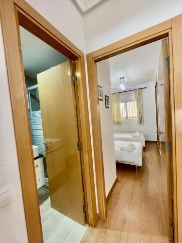 a room with a door leading to a bedroom at Apartment Costa Azahar II Ref 012 in El Borseral