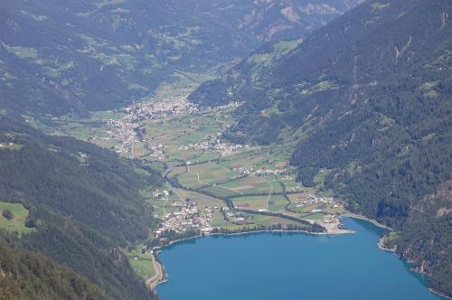 an aerial view of a lake in the mountains at B&B Alpina in Le Prese