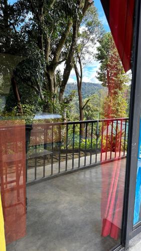 a view of a view from a window of a balcony at Fair View Cottage in Ella