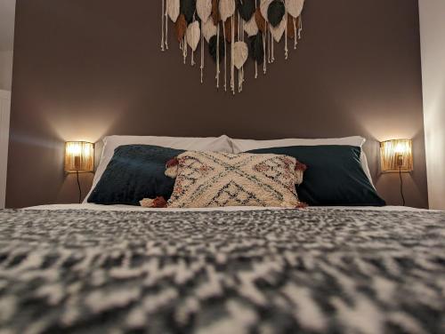 a bedroom with a large bed with two lamps at Wellington Circus in Nottingham