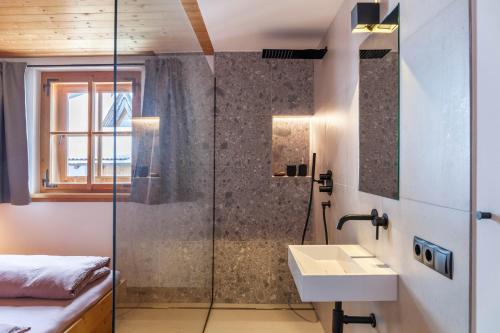 a bathroom with a shower and a sink at Chalet Flocke Appart Murmeltier in Sankt Anton am Arlberg