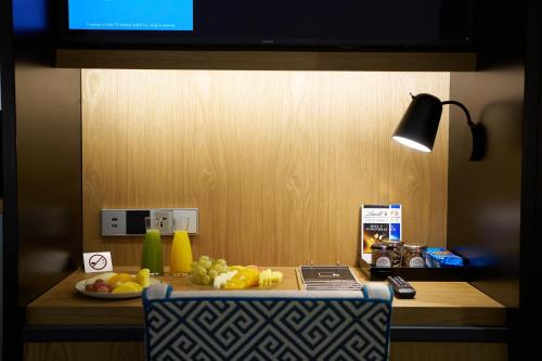 a kitchen counter with fruit on top of it at Hotel Regina in Madrid