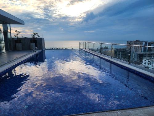 a swimming pool on the roof of a building at Hotel Windy Terrace in Cox's Bazar