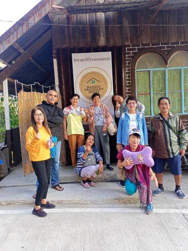 a group of people standing in front of a building at Banaue Transient House Bed and Breakfast in Banaue