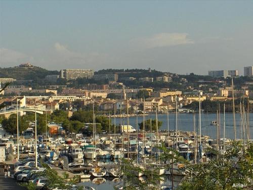 a bunch of boats docked in a harbor at Le Havre de Ferrieres - free Parking - WiFi - Cuisine in Martigues