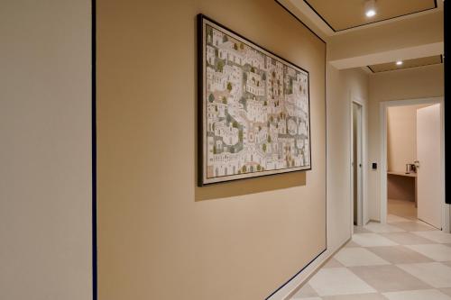 a hallway with a painting hanging on a wall at La Villa in Novara