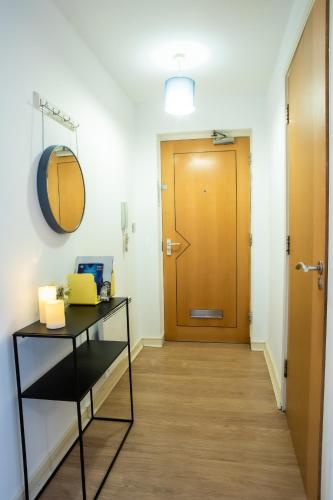 a hallway of an office with a door and a table at Newly furnished Appartment near Train Station wolverhampton in Wolverhampton