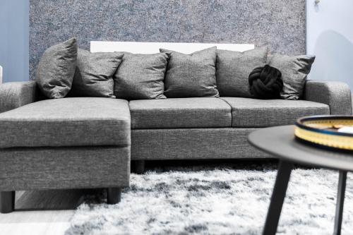 a couch and a table in a living room at The Town Haus By Homebay in Northampton