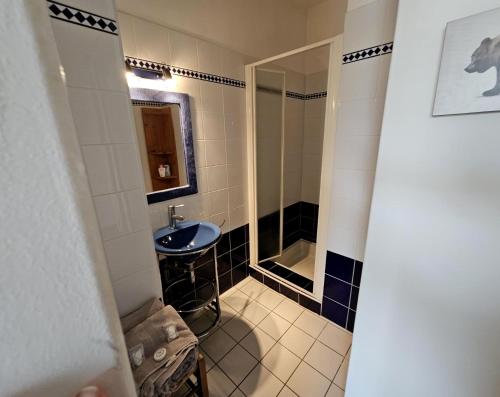 a bathroom with a sink and a shower at Villa Mars YourHostHelper in Narbonne