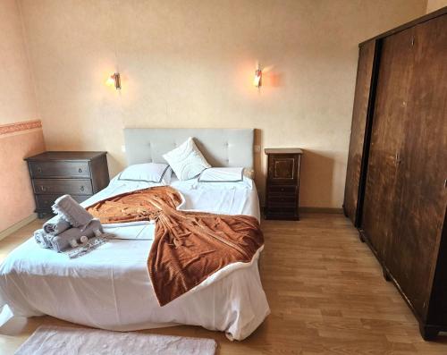 a bedroom with two beds with a stuffed animal on the bed at Villa Mars YourHostHelper in Narbonne