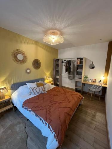 a bedroom with a large bed in a room at Logement cosy entier in Le Kremlin-Bicêtre