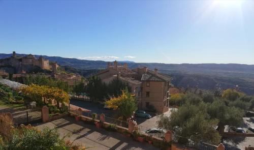 an aerial view of a town with buildings and trees at Hotel Vinoteca Alquezar - Adults Only - in Alquézar