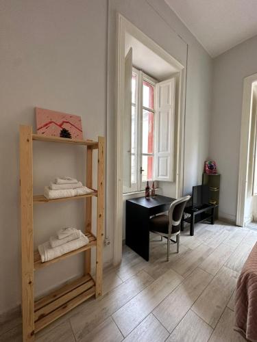 a room with a desk and a chair and a desk at Cupola San Marcellino in Naples