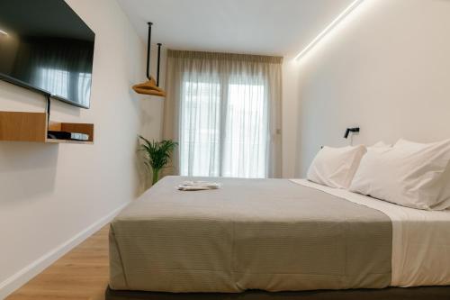 En eller flere senge i et værelse på 31 Doors Hotel